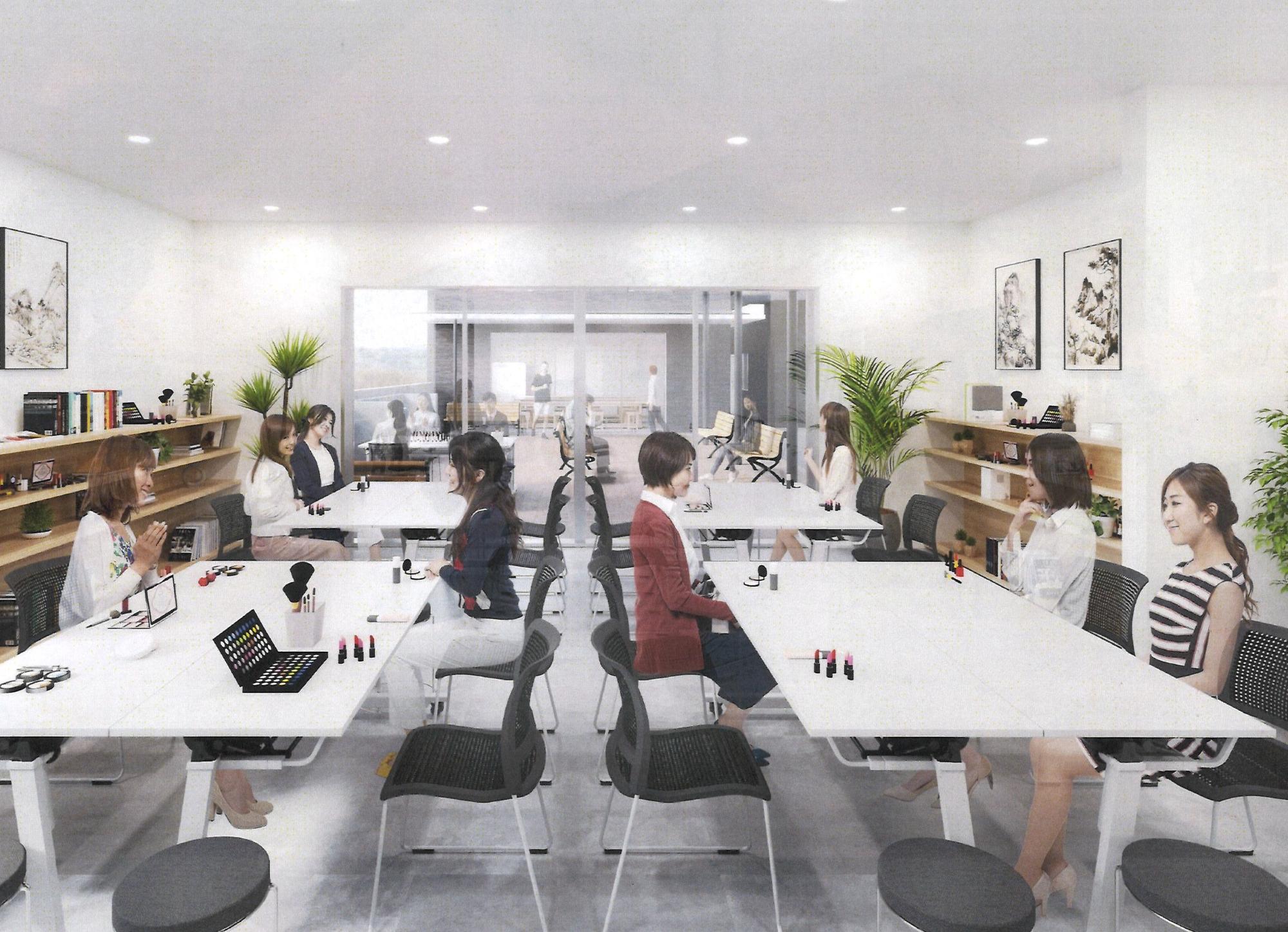 白い壁の広いスペースに白きテーブルが配置されている写真